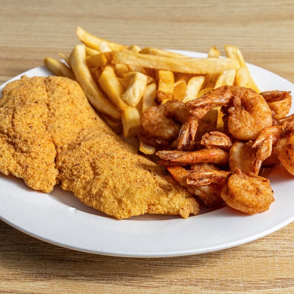Fried fish fillet, crispy shrimp, and golden french fries on a white plate.